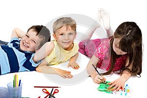 Three Children Happily Drawing photo