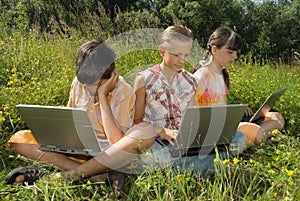 Three children with laptop