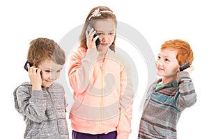 Three children talking on kids mobile phone
