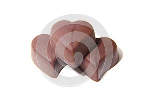 Three chocolate candy in the shape of heart