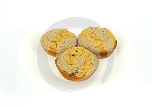 Three chocolate chip muffins on a white plate