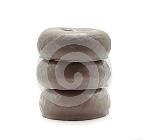 Three Chocolate donuts isolated on a white background.