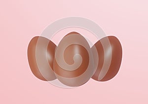 Three Chocolate Easter Eggs on pink background