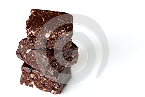 Three Chocolate Fudge Squares Stacked on White Background