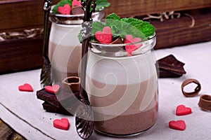 Three chocolate mousse dessert in a glass jar