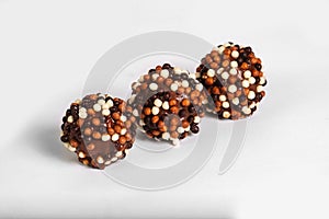 Chocolate truffles on white background