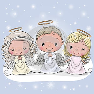 Three Christmas angels on a blue background