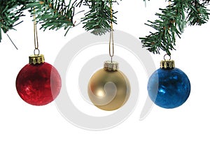 Three christmas ball ornaments with tree branches isolated.