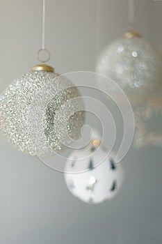 Several Christmas ornaments hanging on a white background