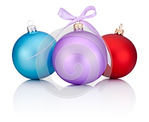 Three christmas balls red, blue and purple with ribbon bow