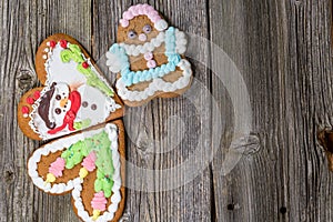 Three Christmas Gingerbread Cookies on Wooden Table on Wooden Table