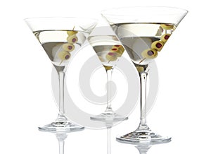 Three classic dry martini with olives isolated on white background