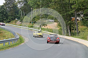 Three classic italian sports cars on road