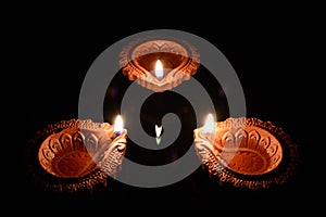 Three Clay Diyas