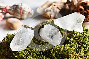 Three Clear Quartz Crystal on Green Moss