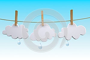 Three clouds hanging by clothes peg on a clothesline