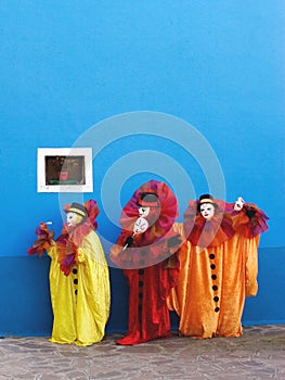 Three clowns performing