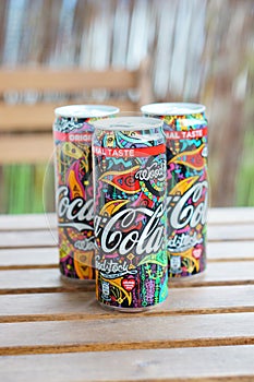 Three Coca Cola cans