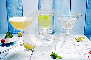 Three cocktail over wooden blue background