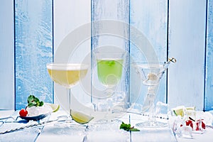 Three cocktail over wooden blue background