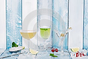 Three cocktail over wooden blue background