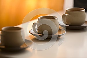 Three coffee cups and saucers photo