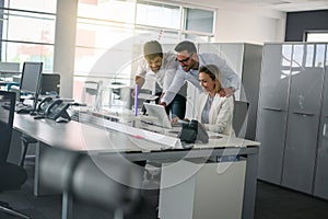 Three colleague in office using computer Business people in offi