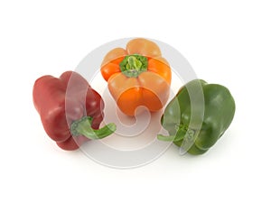 Three color bell peppers isolated close up