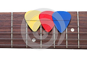 Three color mediators on a guitar fingerboard