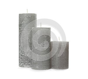 Three color wax candles on white