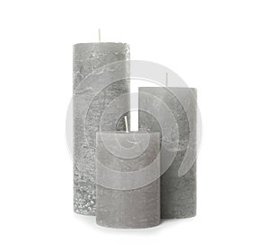 Three color wax candles on white