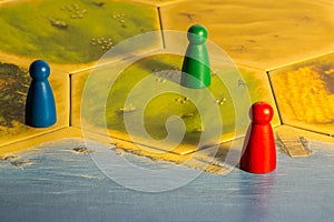 Three colored chips on yellow game board