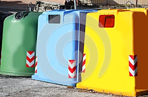 three colored dumpster to collect glass used paper and plastic m