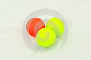 Three colored golf balls