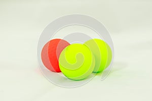 Three colored golf balls