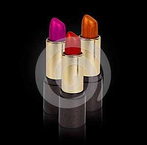 Three colored lipsticks