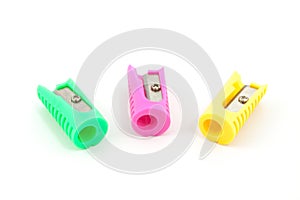 Three colored pencil sharpeners