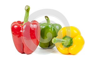 Three colored peppers on white background