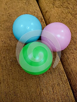 Three colored plastic balls