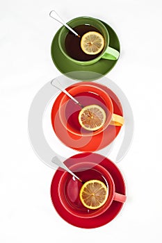 Three colored tea cups