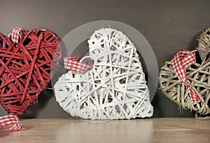 Three colored weaved hearts photo