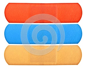 Three colorful bandages isolated on white background