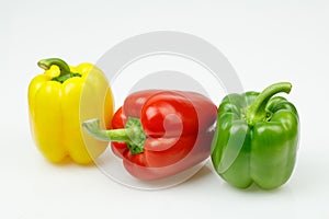 Three colorful bell peppers