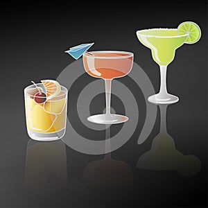 Three colorful cocktails in different glasses with lime, orange and cherry decoration and their reflection shadow against black