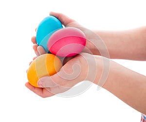 Three colorful easter eggs in child hands