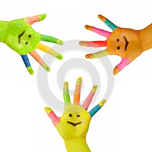 Three colorful hands with smile painted