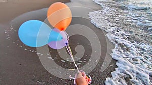 Three colorful inflatable balls background sea at dawn sunset Person playing