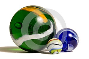 Three Colorful Marbles In Three Sizes