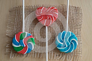 Three colorful sugar lollipops