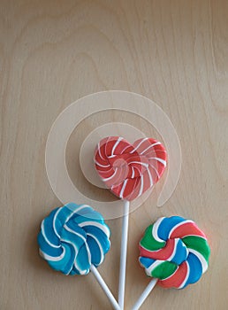 Three colorful sugar lollipops